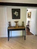 a table with a vase on it in a room at Central Valbonne Villa in Valbonne