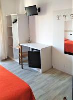 A bed or beds in a room at Hotel Ciao Bed & Breakfast