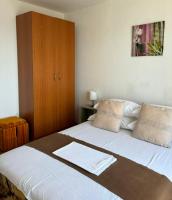 Postel nebo postele na pokoji v ubytování Helen Apartments