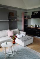 a living room with a white couch and a table at Apfelhof Biesenbrow in Biesenbrow