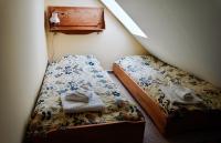 two beds in a small room with a bedskirts at Apfelhof Biesenbrow in Biesenbrow