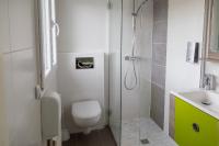 a bathroom with a shower and a toilet and a sink at Hostellerie De La Mer in Crozon