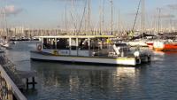 a boat docked in a marina with other boats at Nuit insolite dans un petit voilier in La Rochelle