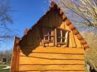a log cabin with two windows on the roof at L&#39;Escale des Châteaux de la Loire in Angé