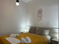 Posteľ alebo postele v izbe v ubytovaní Myrtos Cosy Apartments