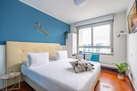 A bed or beds in a room at Camplus Lambrate Casa per Ferie