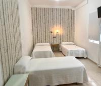 Posteľ alebo postele v izbe v ubytovaní Hotel Alamo