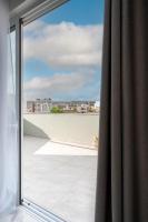 a sliding glass door with a view of a balcony at Msida Central Suites in Msida
