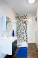 a bathroom with a sink and a shower at Msida Central Suites in Msida