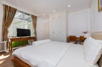 Ein Bett oder Betten in einem Zimmer der Unterkunft Biệt Thự Lan Anh Đà Lạt