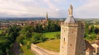 a view of the city from the tower of a castle at Contact Hôtel du Commerce et son restaurant Côte à Côte in Autun