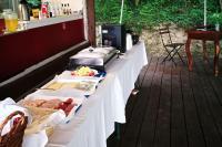 a long white table with food on top of it at Glamp-Inn Kapolcs in Kapolcs