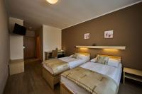 Postel nebo postele na pokoji v ubytování Hotel Akademie