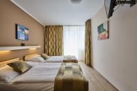 Postel nebo postele na pokoji v ubytování Hotel Akademie