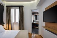 Posteľ alebo postele v izbe v ubytovaní Acropolis Unique Residence