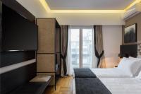 Posteľ alebo postele v izbe v ubytovaní Acropolis Unique Residence