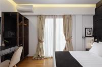 Posteľ alebo postele v izbe v ubytovaní Acropolis Unique Residence