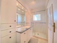 a white bathroom with a sink and a shower at Maison Pornichet, 3 pièces, 6 personnes - FR-1-245-155 in Pornichet