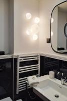 a bathroom with a sink and a mirror at Hotel Elysa-Luxembourg in Paris
