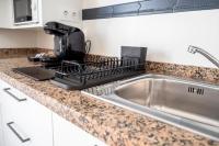 Kuchyňa alebo kuchynka v ubytovaní CALMA Apartments