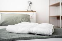 Posteľ alebo postele v izbe v ubytovaní CALMA Apartments