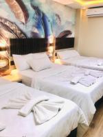 Postel nebo postele na pokoji v ubytování Bonita Hotel