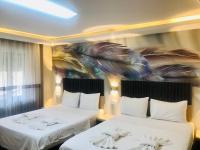 Postel nebo postele na pokoji v ubytování Bonita Hotel