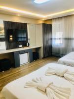 Postel nebo postele na pokoji v ubytování Bonita Hotel