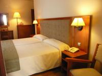 Posteľ alebo postele v izbe v ubytovaní Hotel Sierra Las Villas