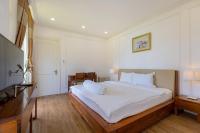 Ein Bett oder Betten in einem Zimmer der Unterkunft Biệt Thự Lan Anh Đà Lạt