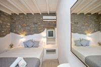 A bed or beds in a room at Artemis Apartments