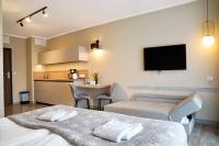 Televízia a/alebo spoločenská miestnosť v ubytovaní BelMare by Baltic Home