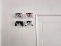 a door with four video game controllers hanging from it at Field Trail Homestay in Jiaoxi