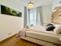 Posteľ alebo postele v izbe v ubytovaní Apartament Caroline Q4Apartments