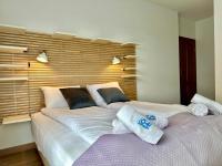 Posteľ alebo postele v izbe v ubytovaní Apartament Caroline Q4Apartments