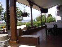 a patio with a table and chairs and a view at STUDIO DELUXE IN MARINA CAPE 4 stars complex 33 7 in Aheloy