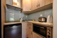 A kitchen or kitchenette at Pieros Studios Alipa