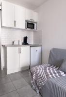 Kuchnia lub aneks kuchenny w obiekcie Cosy Appartement - 4 personnes - Disneyland & Paris