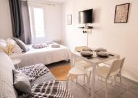 Łóżko lub łóżka w pokoju w obiekcie Cosy Appartement - 4 personnes - Disneyland & Paris
