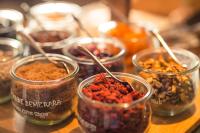 a group of glass jars filled with different types of food at Hotel D - Strasbourg in Strasbourg