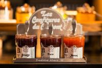 a group of three jars of jam on a table at Hotel D - Strasbourg in Strasbourg