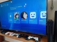a tv screen with several video game controllers at Field Trail Homestay in Jiaoxi