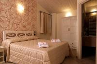 Postel nebo postele na pokoji v ubytování Agriturismo Il Barone