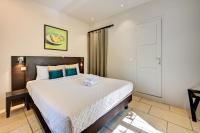 a bedroom with a large bed with towels on it at Hostellerie Le Paradou in Lourmarin
