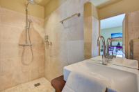 a bathroom with a shower and a sink at Hostellerie Le Paradou in Lourmarin