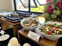 a table with bowls of salad and other foods at LB Pietz Pension House in Cordova