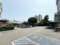 a parking lot with cars parked in a city at Ai Lai Fashion Hotel in Taichung