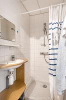 a bathroom with a sink and a shower at La villa Laurette - Maison de vacances familiale in Île dʼAix