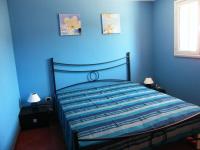 A bed or beds in a room at LENTISCHIO villetta vista mare a 250 metri dalla spiaggia con ARIA CONDIZIONATA