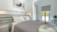 Hermoso Luxury Suitesにあるベッド